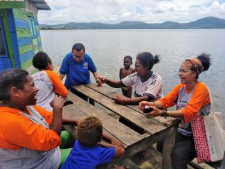 In Jayapura, we build awareness of gender-based violence through discussions with community members. 