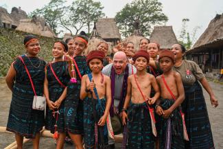 Mission Director Jeff Cohen with children and residents of Bena traditional village in Ngada District, Flores