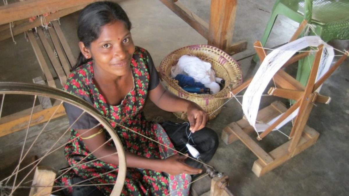 Sri Lankan artisan uses a traditional handloom to make woven clothing. The woman in this picture is using her skills to support her own livelihood, and also create a competitive brand for international markets. IESC's VEGA Facilitating Economic Growth Project seeks to strengthen livelihoods and businesses throughout Sri Lanka. (Photo by IESC / Danielle Wilkins)