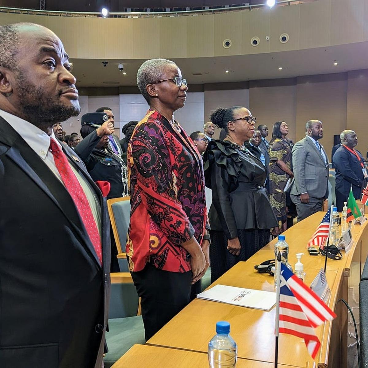USAID Assistant Administrator in the Bureau for Africa Monde Muyangwa, third from left, joins the official U.S. and Zambia delegation to the second Summit for Democracy during the national anthem of the closing ceremony on March 30, 2023. 