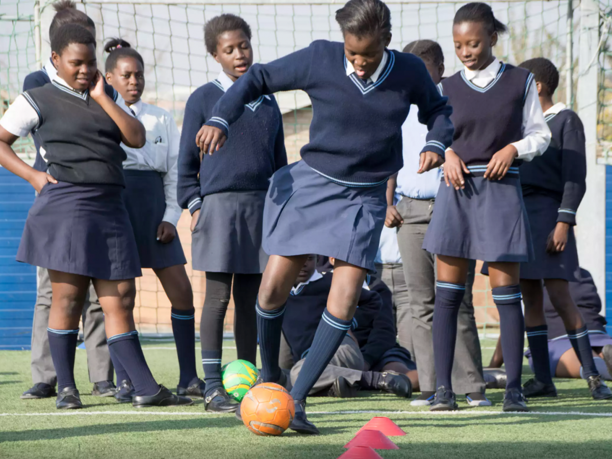 Girls play soccer in South Africa.