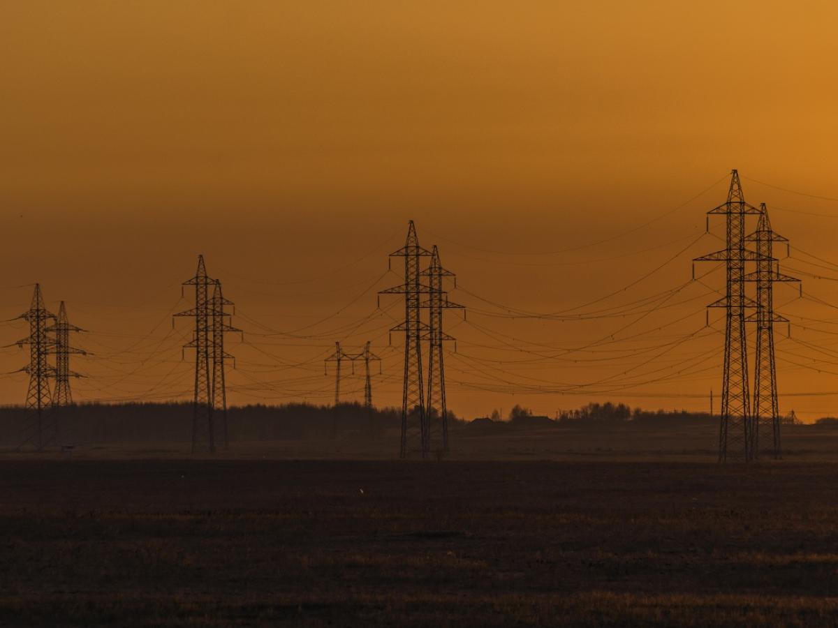 An image of electrical grids at sunset