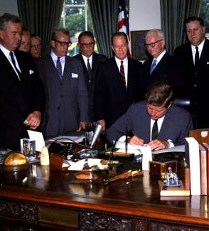 President Kennedy signs the Foreign Assistance Act of 1961