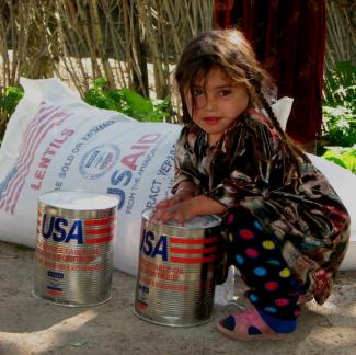 Families receiving flour, lentils, and vegetable oil to supplement their food intake in the rural mountainous areas of Tajikistan.