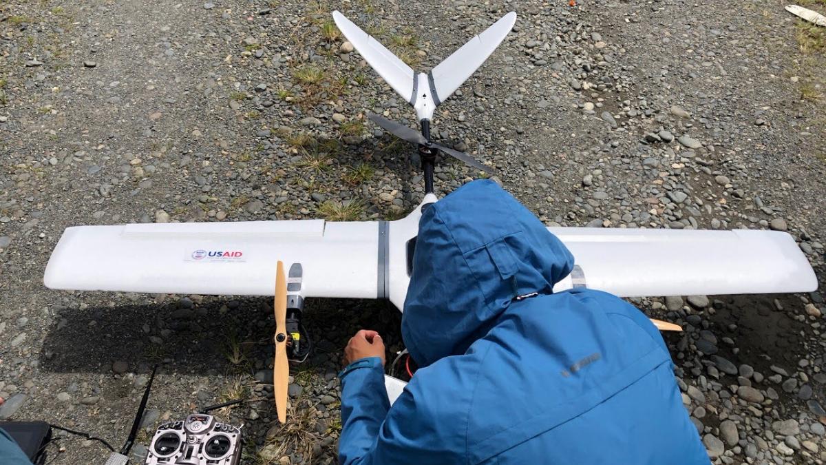 A person works on a remote controlled airplane