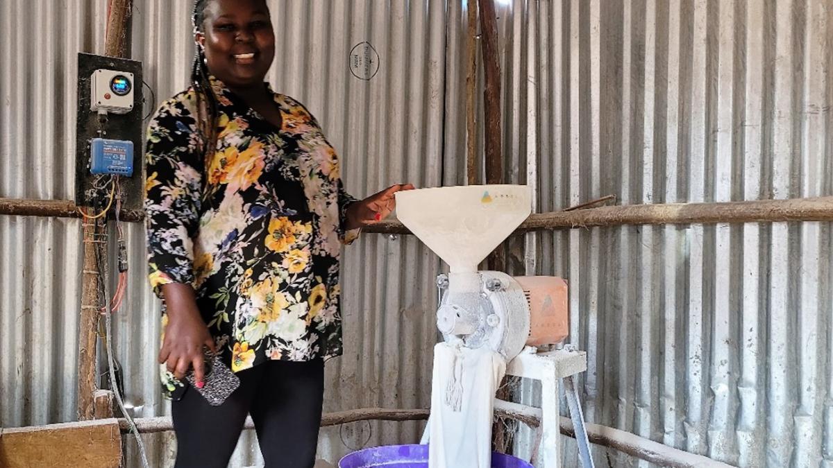 Magdalene Mbinya using a solar-powered mill on her farm in Yatta, Machakos County, Kenya.