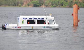 U.S.-donated "Health Voyager" boat on its maiden voyage in February 2024. The boat will bring health services to Oti's island communities.