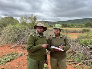 Filster and Violet, SAA-trained rangers carrying out their daily tasks at Kasigau Wildlife Conservancy. They also lead community engagements aimed at confronting and changing harmful gender stereotypes. PHOTO CREDIT: Joyce Mbataru 