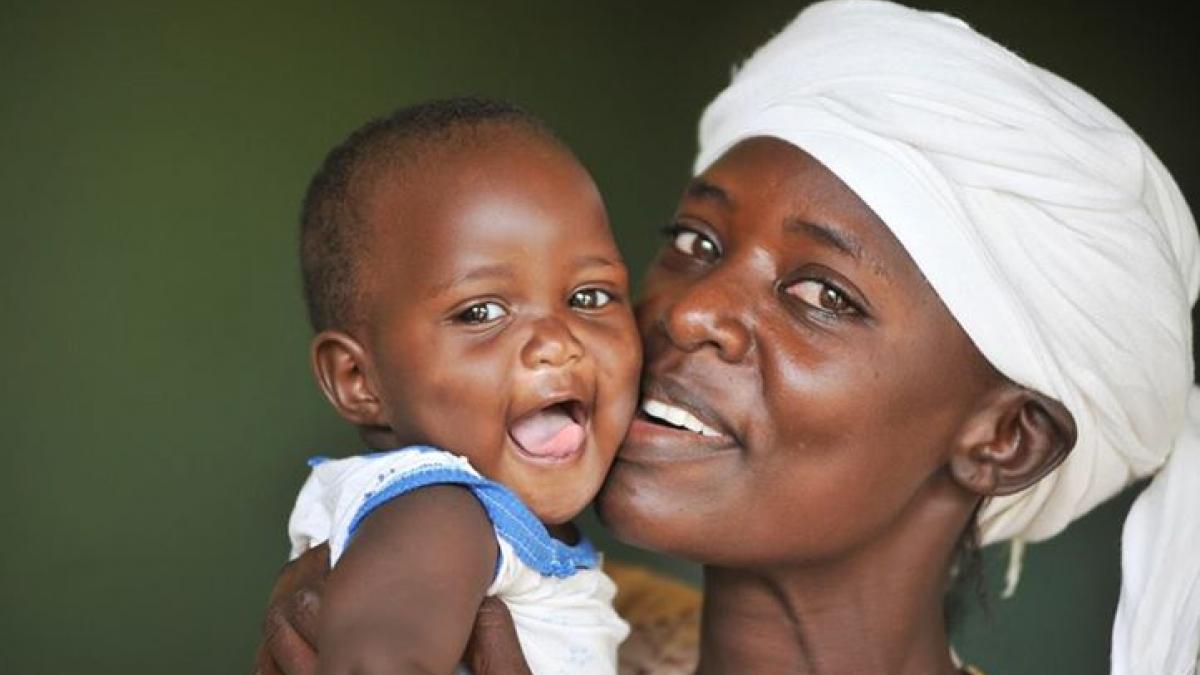 Photo of a smiling woman and child