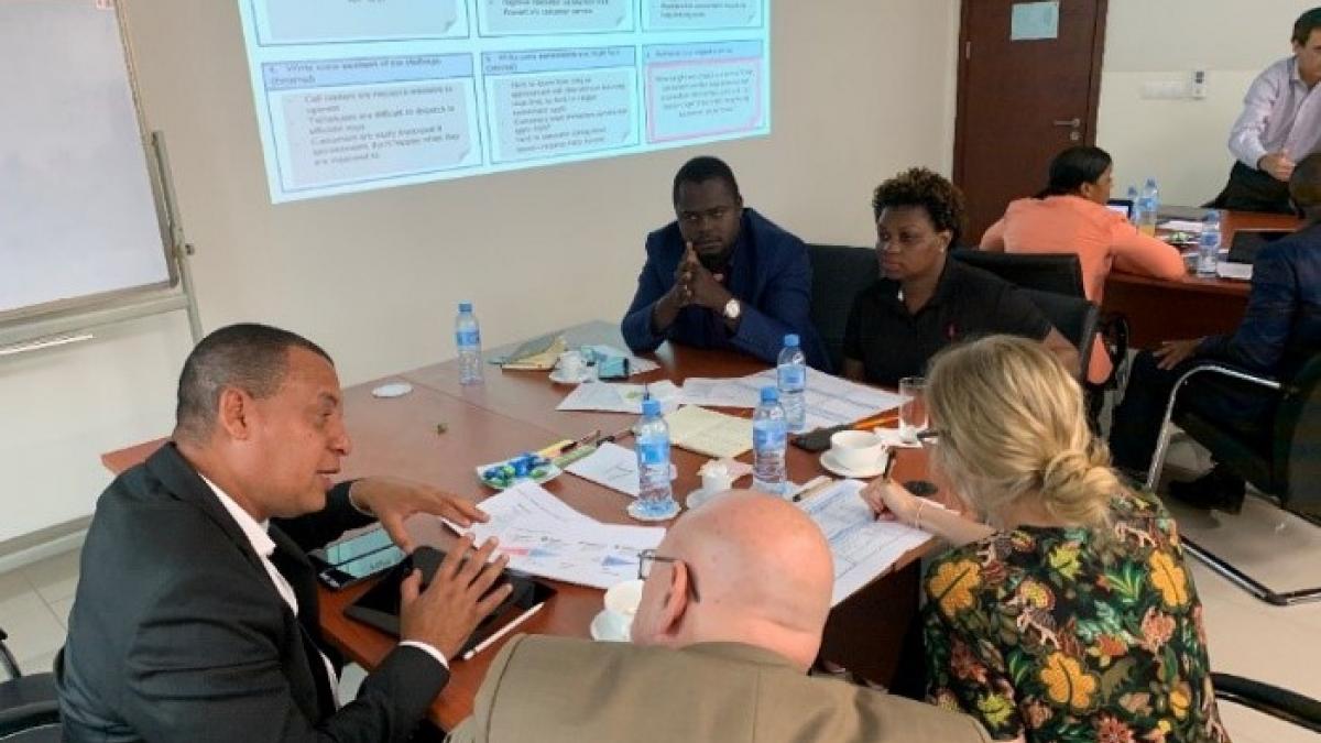 Electricidade de Moçambique executives, including General Director for Commercial, Benjamim Fernandes, learn about the HCD process during a workshop in Maputo in December 2019. 