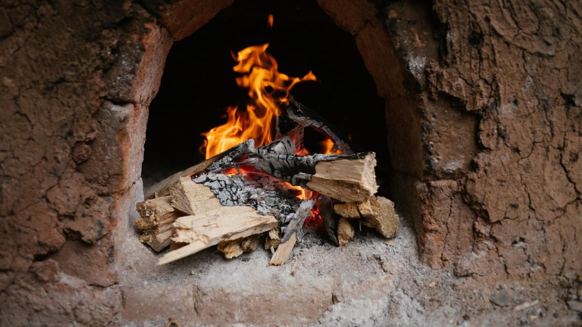 Wood burning in kiln.