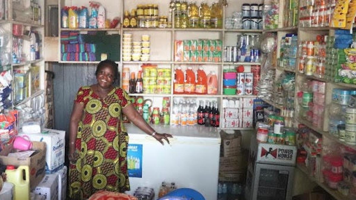 Business owner Irene Tumusiime shows off her shop in Uganda. 