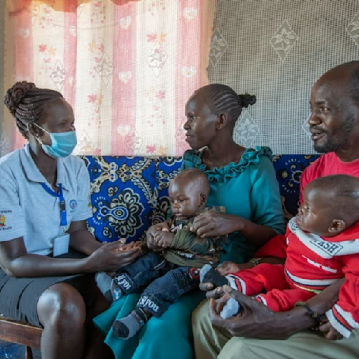 Community health worker, Catherine, spends time educating a family on how to keep everyone safe and healthy in Baringo County, Kenya.