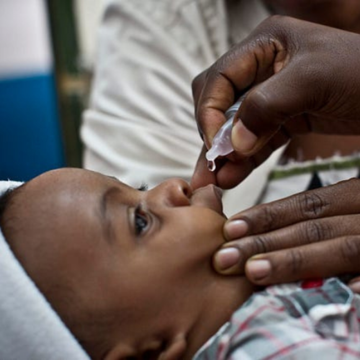 A child receives a polio vaccine at a health center in Ishaka Mberare, Uganda.