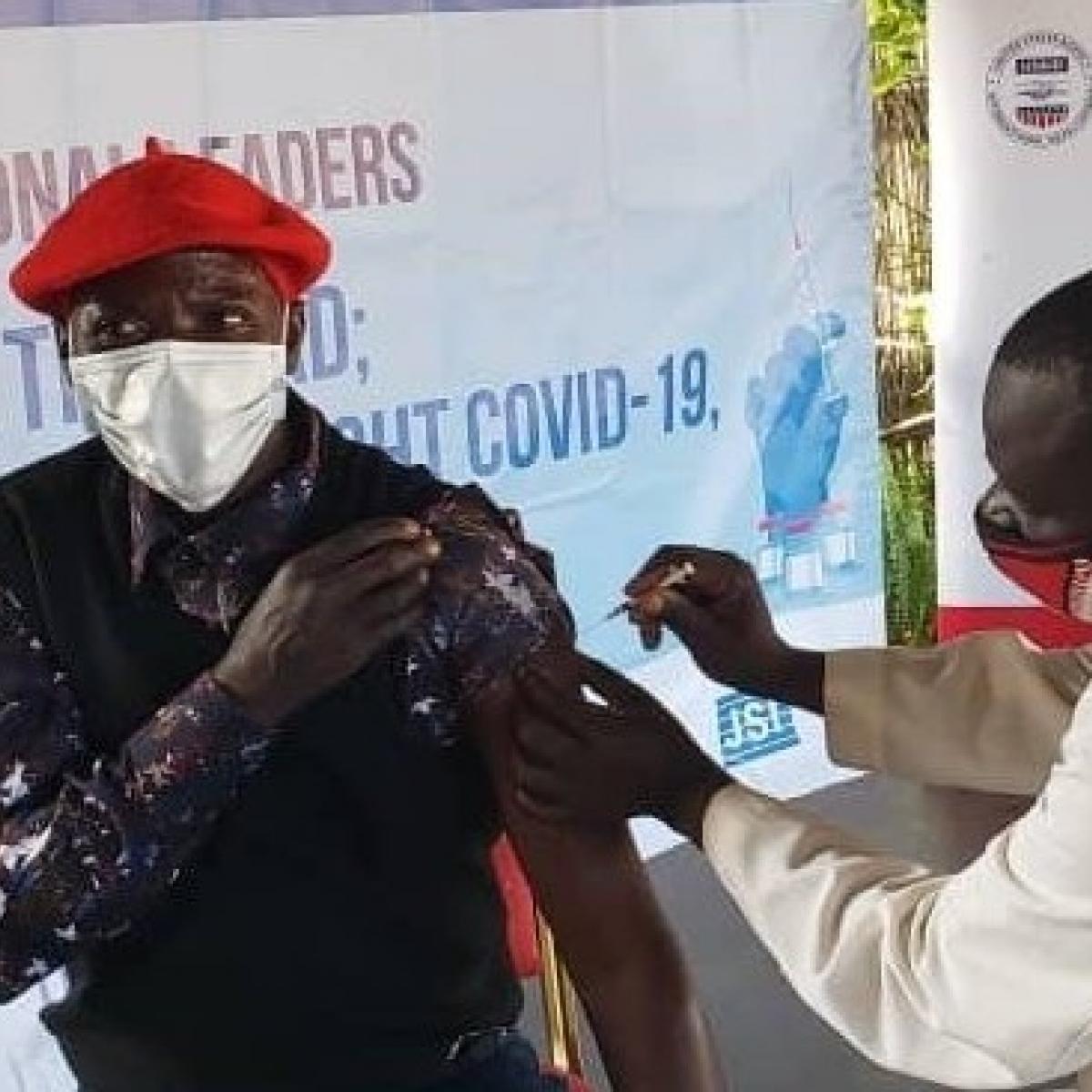 As part of the Zambia Ministry of Health "Take the Lead, Roll Up Your Sleeve" initiative, with USAID DISCOVER-Health support, an Induna (traditional leader) in Zambia's Western Province receives the COVID-19 vaccine and encourages community members to do the same.