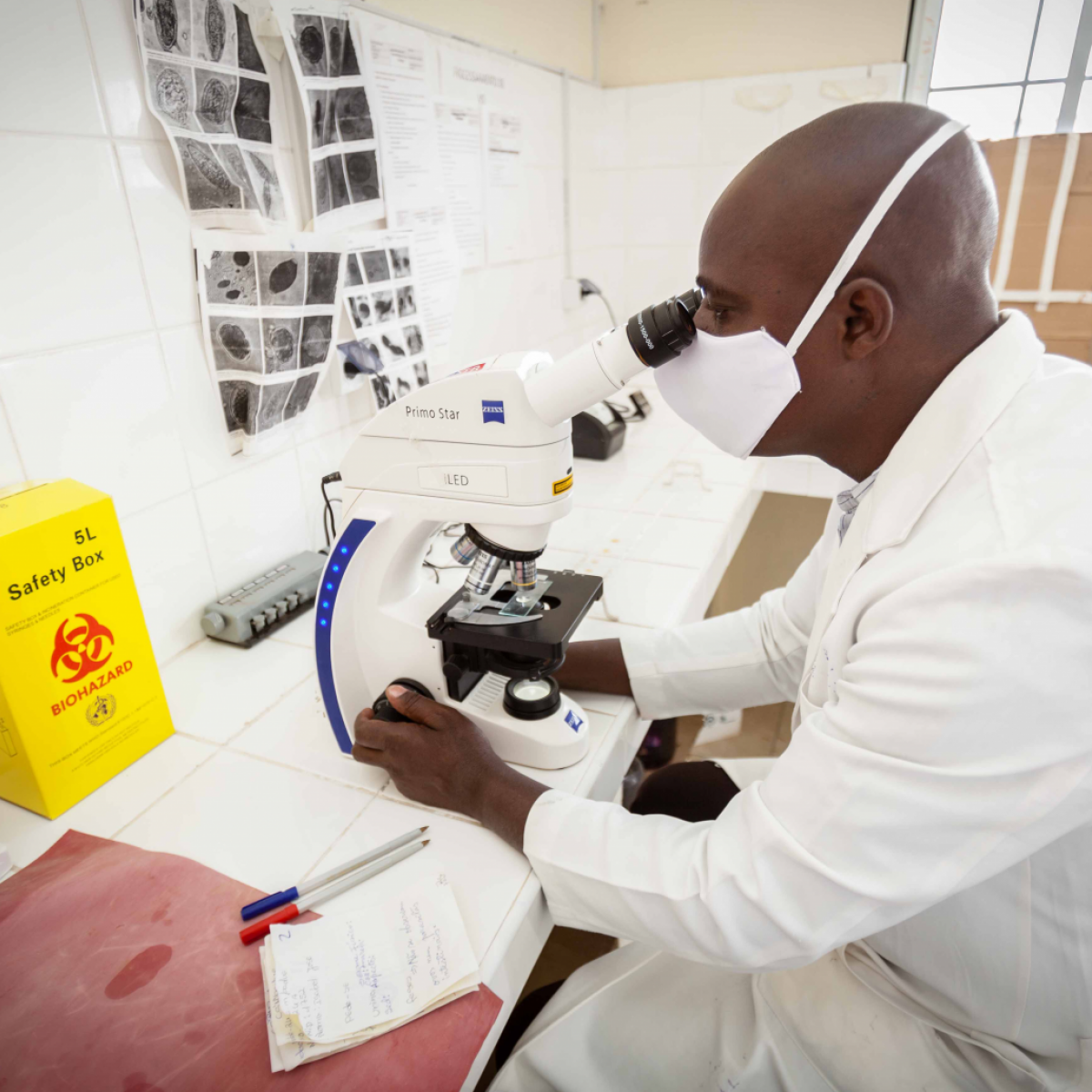 In Mozambique, a health worker collects and labels a viral load testing sample.