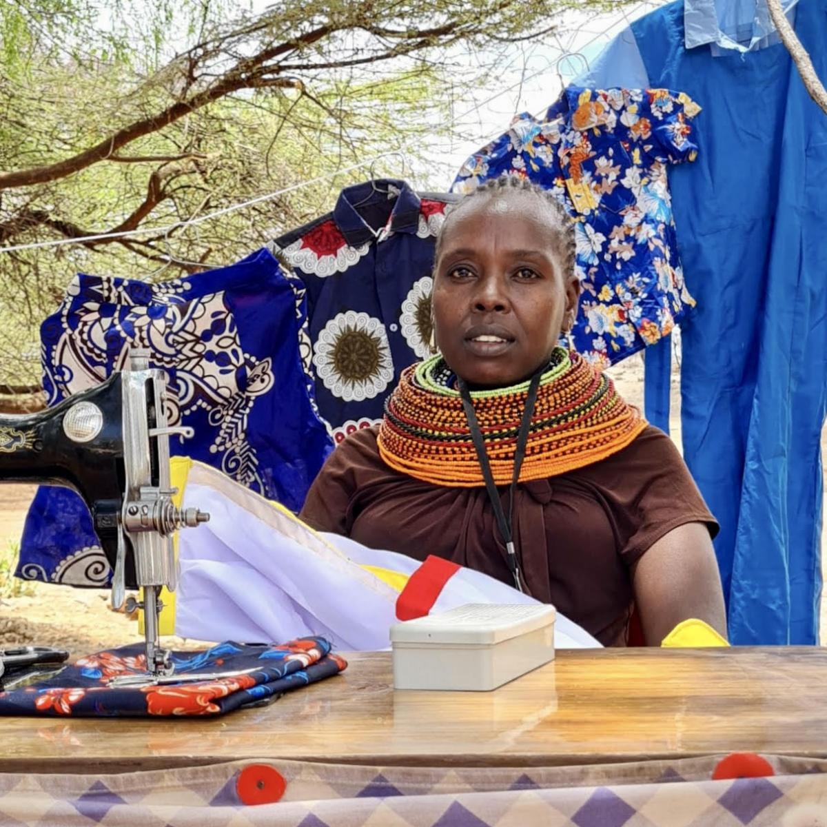 Jane Asimit launched her own seamstress business from home after receiving USAID-supported vocational training and a sewing machine. It has since grown into a successful local shop training young women. Photo: Norin Walimohamed/USAID