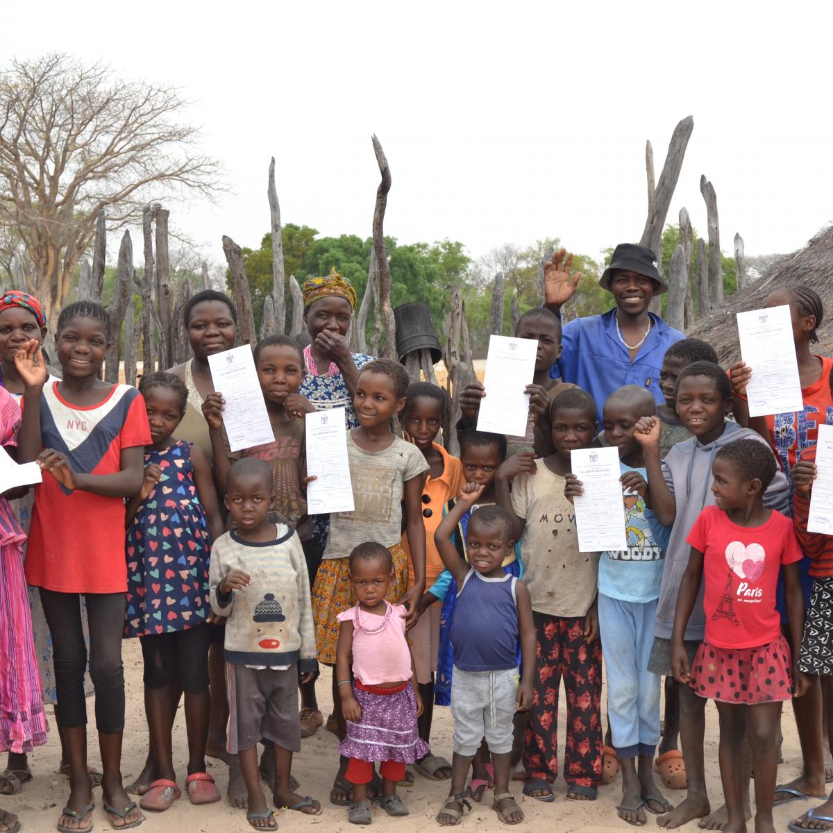 Namibian children holding their newly acquired birth certificates 