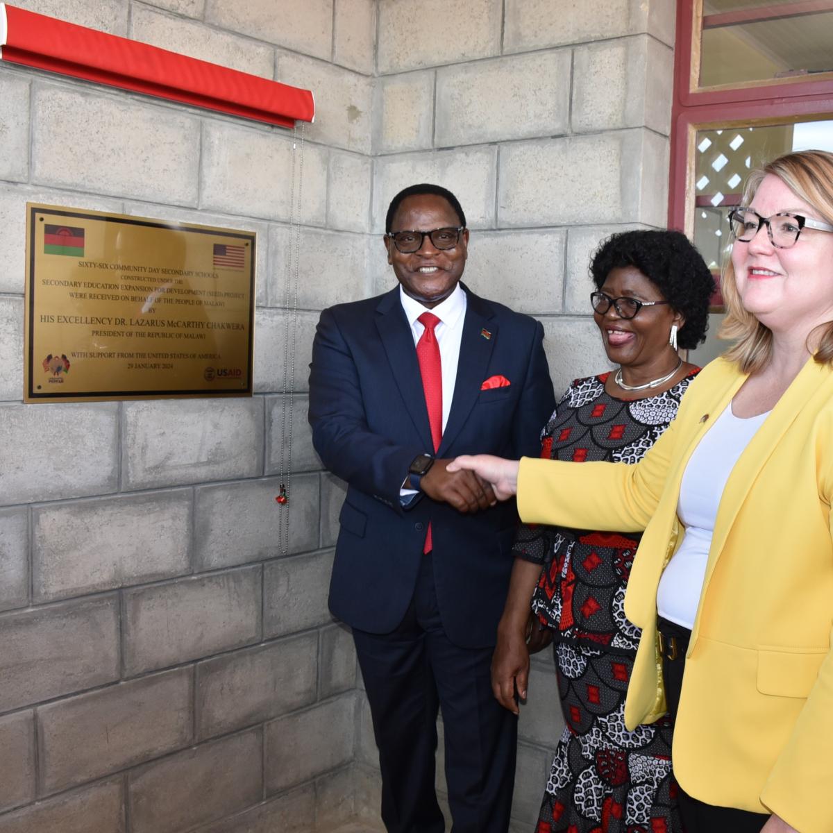Chargé d’Affaires Amy Diaz, a.i. of U.S. Embassy Lilongwe, at Mkanga Community Day Secondary school, stands in front of a commemorative plaque with Malawi President Dr. Lazarus Chakwera and his wife during the new school’s ribbon cutting ceremony. Photo Credit: Marcus Muhariwa, U.S. Embassy