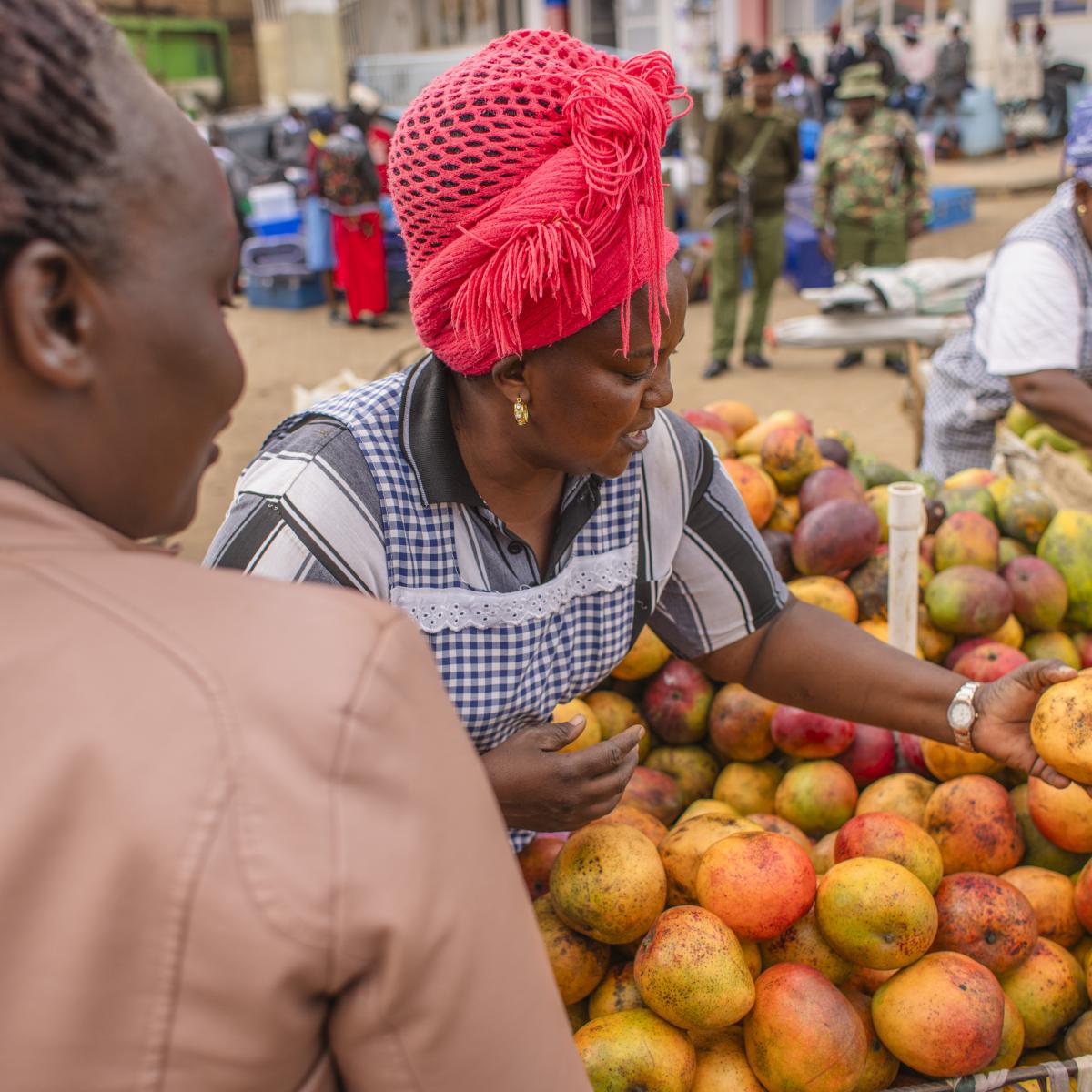 A woman shops for fruit in a market in Tala, Kenya.