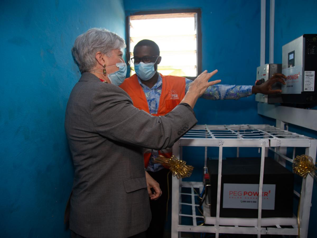 U.S. Ambassador to Ghana, Stephanie S. Sullivan, inspects a installation by PEG Ghana at a rural clinic