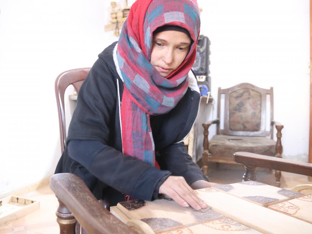 Syrian women practicing wood carving 1
