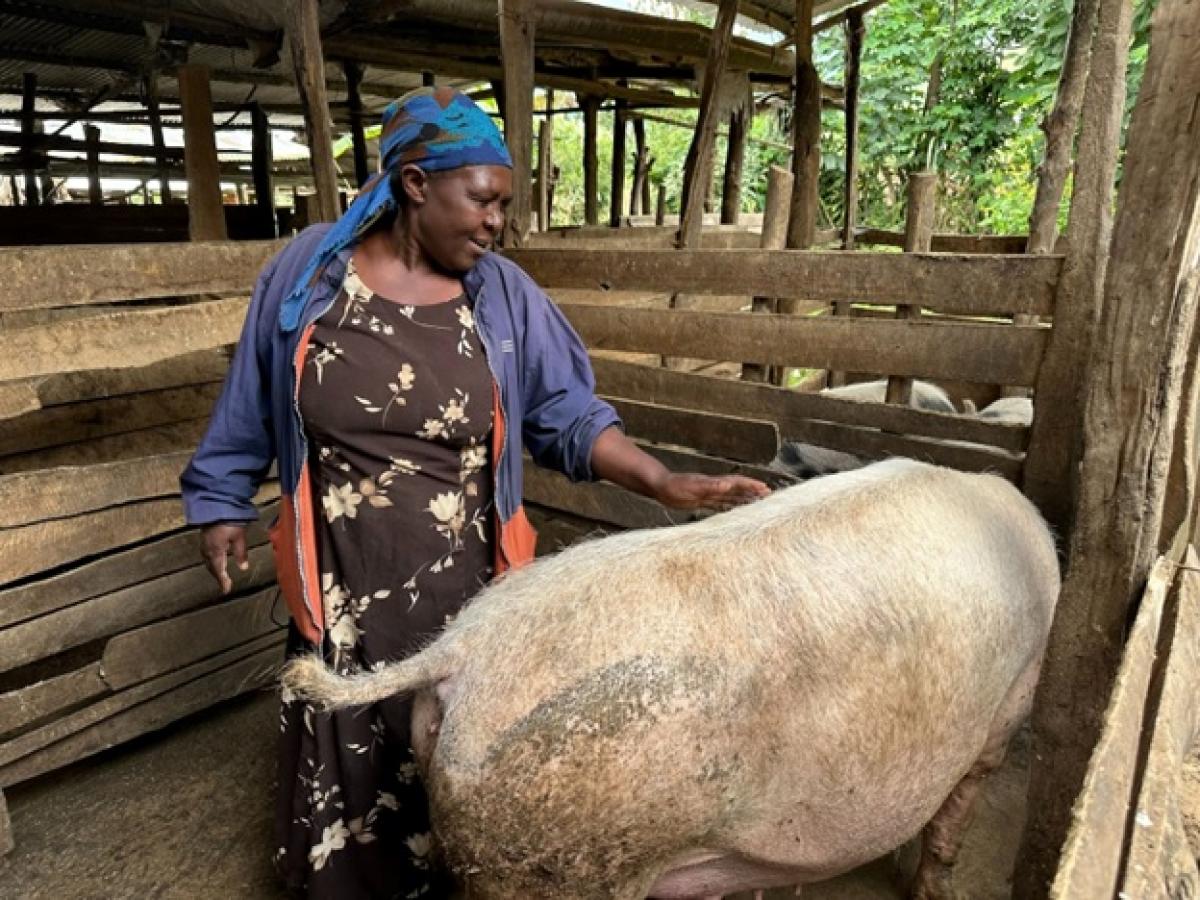 Farmer with her pig. 