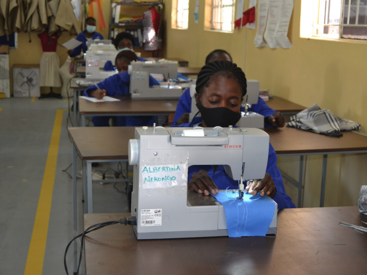 Adolescent Girls and Young Women (AGYW) in the DREAMS program work at sewing machines