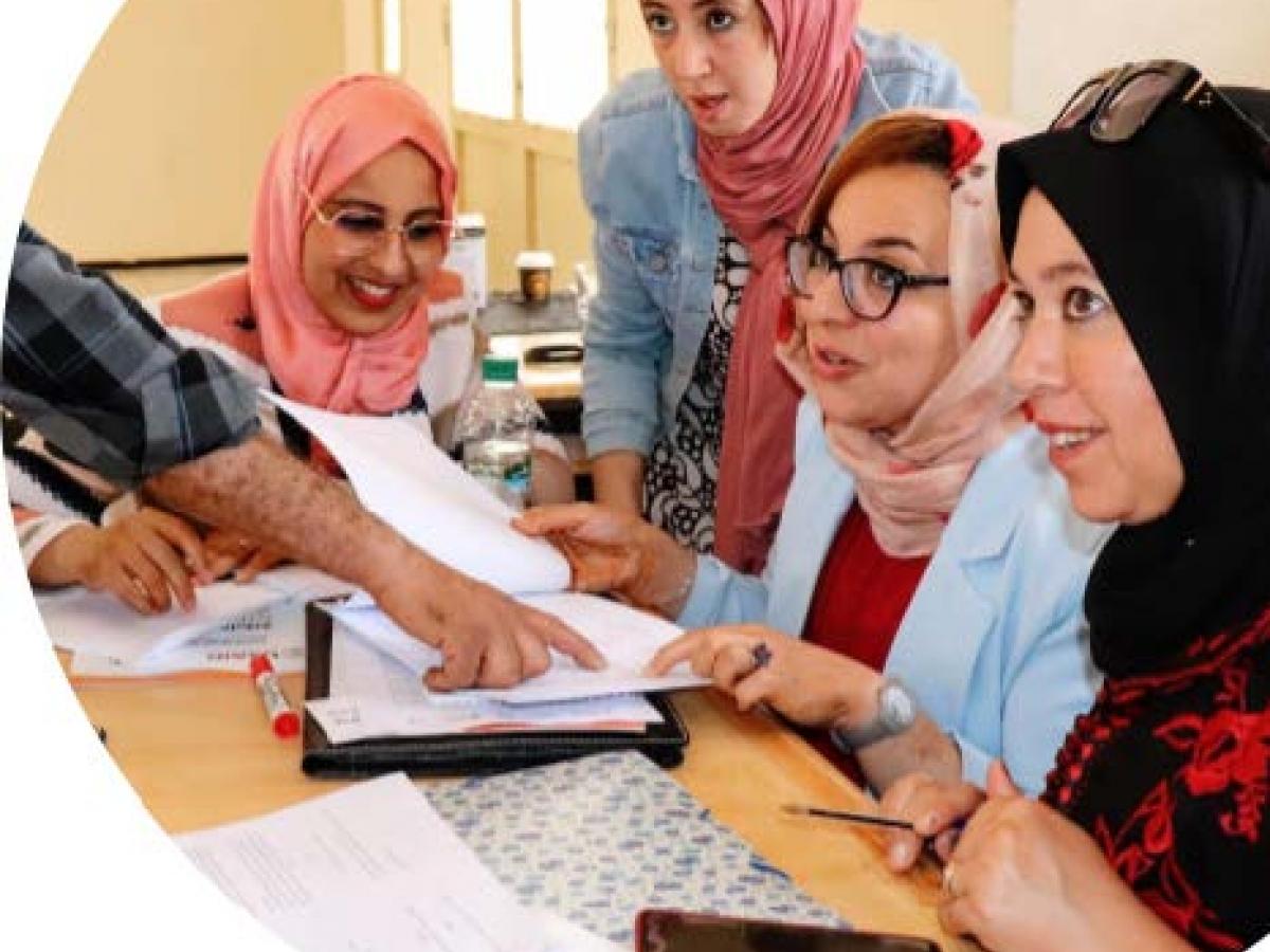 A photo of four Moroccan women working together at a training