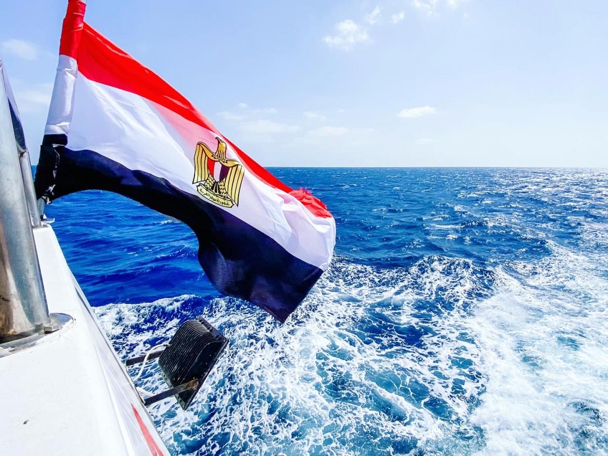 An Egyptian flag and view of the Red Sea from a crew ship used during the mooring system installation.