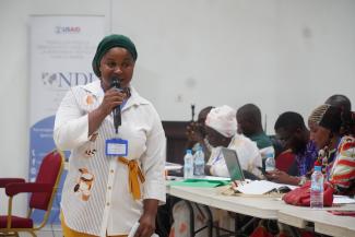 A trainer of trainers addressing participants at the civic and voter education workshop in Conakry in April 2024.
