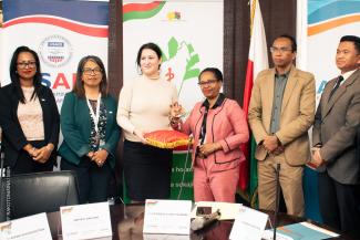 USAID Health, Population and Nutrition Office Director, Sophia Brewer, hand over IT equipment to Madagascar's Ministry of Health