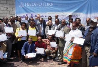 USAID Mission Director Leslie Reed and Minister of Livestock and Fisheries Fekadu Beyene with USAID grantees and CNFA’s Marc Steen