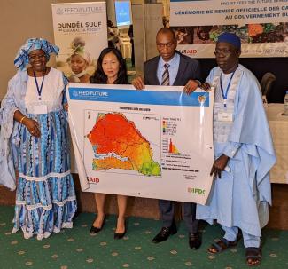 L-R: Dr Mbene Faye, Dundël Suuf Program Manager, Ms Ying Hsu, acting USAID Mission Director, Prof Moussa Balde, Minister of Agriculture and Rural Equipment and Bocar Diagana, IFDC Deputy Director for West and North Africa showing a sample soil fertility map.