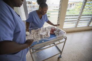 OBGYN, Dr. Grace Kagya, caring for a newborn at Eastern Regional Hospital in Koforidua, Ghana