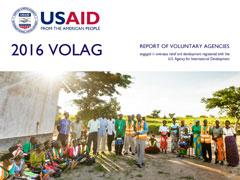 Cover of 2016 VolAg Report: Zambia: Safe Motherhood Action Group community meeting at the Mundabi Rural Health Center. USAID/Zambia Photo, 2017.
