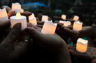 A candle vigil. Credit: Dibyangshu Sarkar, AFP