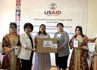 Cherry Gumapas, Health Development Office Director, USAID/Uzbekistan, in the center