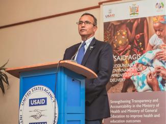 USAID/Zambia Acting Mission Director Robin Sharma delivers remarks during the AGIS project culmination event.