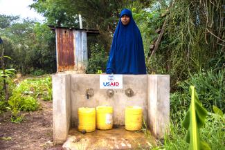 Shinda's daughter fetching water, Isiolo County, USAID's LMS