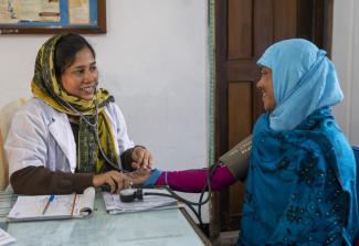 Dr. Farzana Chowdhury consults with a patient in the Surjer Hashi clinic in Sunamganj in northern Bangladesh. Supported by USAID, this clinic run by NGO Service Delivery Programme provides the families with high-quality, low-cost reproductive health, maternal and child healthcare services through 8,000 satellite clinics and 7,000 community health workers.