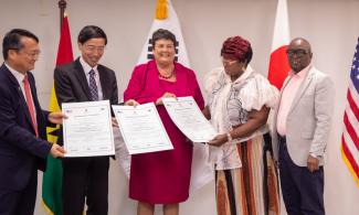 The Ambassadors of the Republic of Korea, Japan, and the United States with Ghana Ministry of Health Officials celebrate the signing of the new agreement.