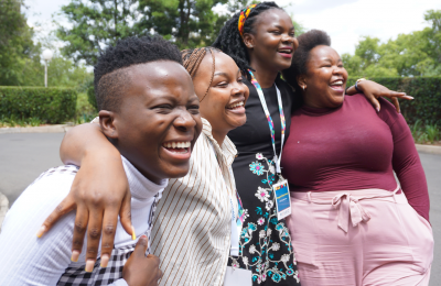 NextGen Squad members having a laugh in Maseru, Lesotho, during MOSAIC’s HIV Prevention Ambassador Facilitators’ Training in October 2022