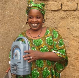 Malian woman with solar-powered radio