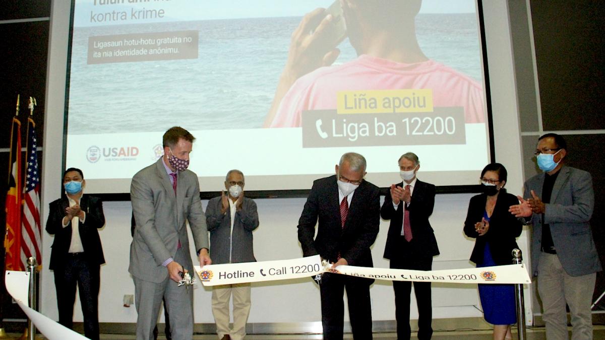 U.S. Ambassador Kevin Blackstone (left) and Timor-Leste's Minister of Finance, H.E. Rui Augusto Gomes, launch the Customs Hotline with USAID support.