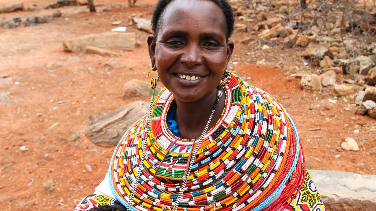 Nalan'gu Lokoloto wearing some of the colorful traditional jewelry helping her make a living.