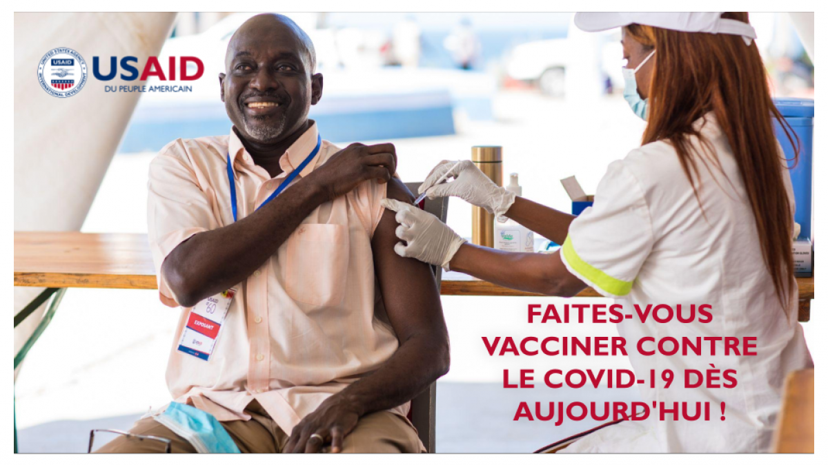 Man gets vaccinated against COVID-19 at a USAID-sponsored clinic