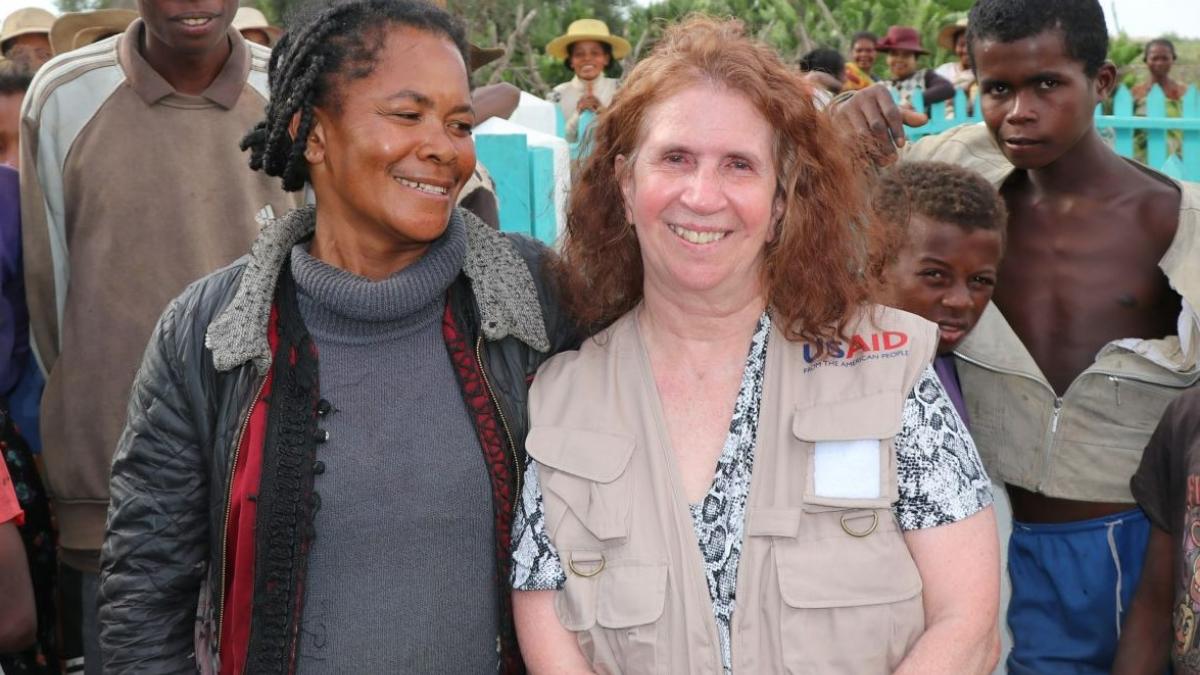 USAID Mission Director Anne Williams meets grateful beneficiary and community leader Celine. 