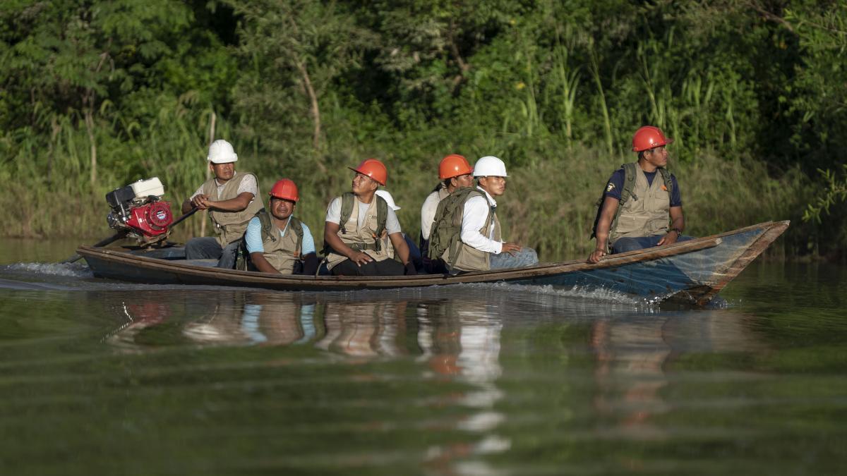 Indigenous People travel by boat on the Peruvian Amazon as part of USAID Forest Alliance’s communal forest management.