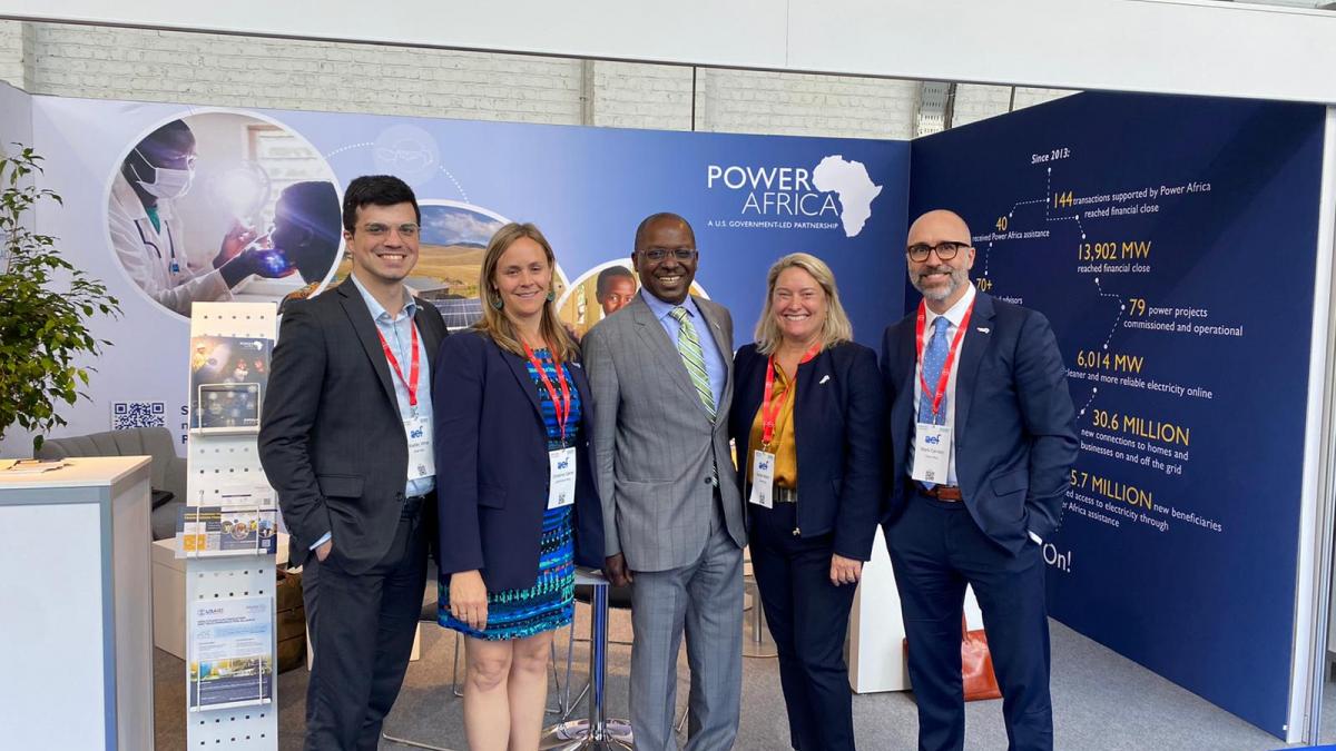 Power Africa staff standing in front of the Power Africa booth at the Africa Energy Forum 2022